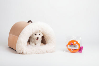 Calming Plush Pet Bed for Cats &amp; Small Dogs shown with a small dog inside a cozy, semi-enclosed design for comfort.